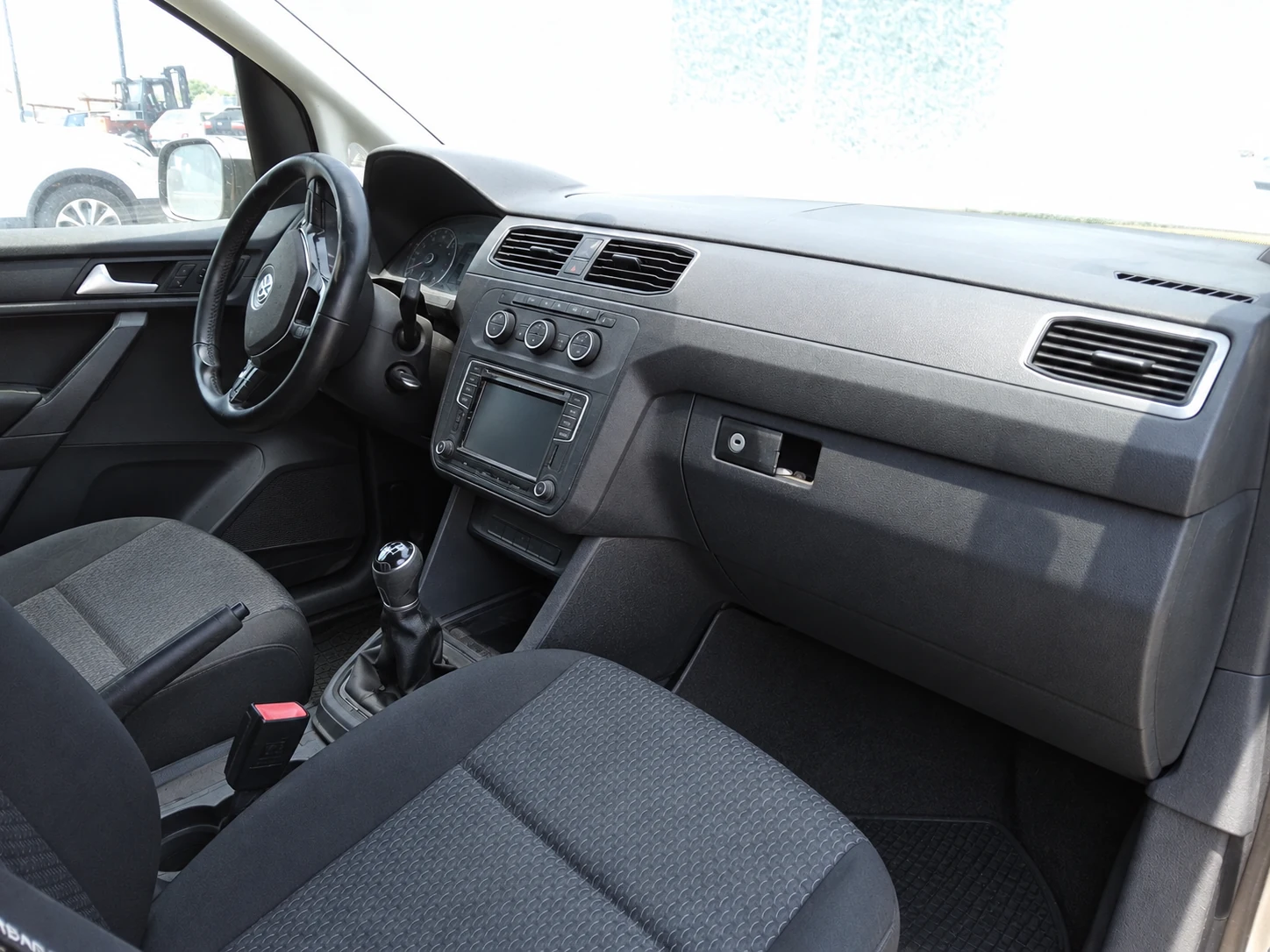 AI-generated clean appearance of the same Caddy interior; illustrative, not an actual cleaning result