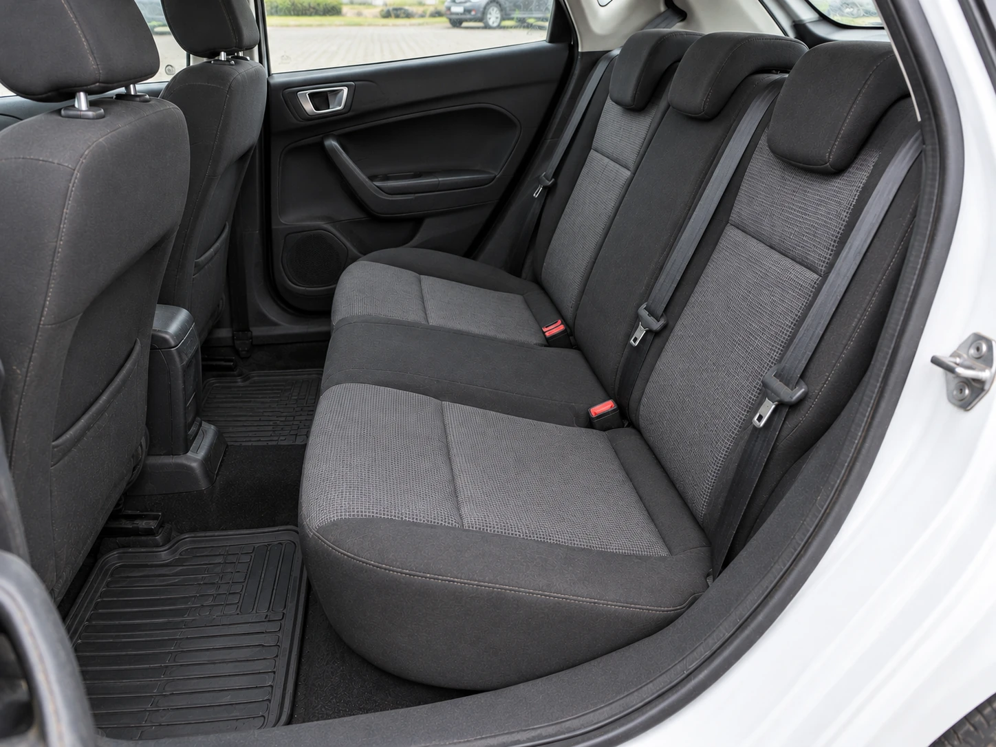 AI illustration of the same Ford Fiesta rear interior in a clean appearance